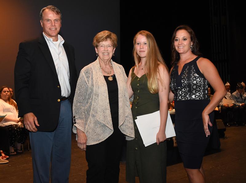 Natalie Evans is shown with (l-r) Cape Superintendent Bob Fulton, Charlotte Hughes of the Delaware Watercolor Society and Cape Principal Nikki Miller.