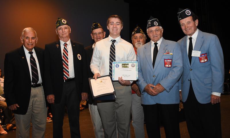 Enoch Jacobson-Haga, center, is shown with (l-r) Col. Ronald Erale, Bob Shiles of Long Neck Sons of AmVets Post 22, Tom Dahl and Patrick Richardson of American Legion Post 5, and Walt Koopman and Jack McGinley of the Korean War Veterans Association Delaware Chapter 1.