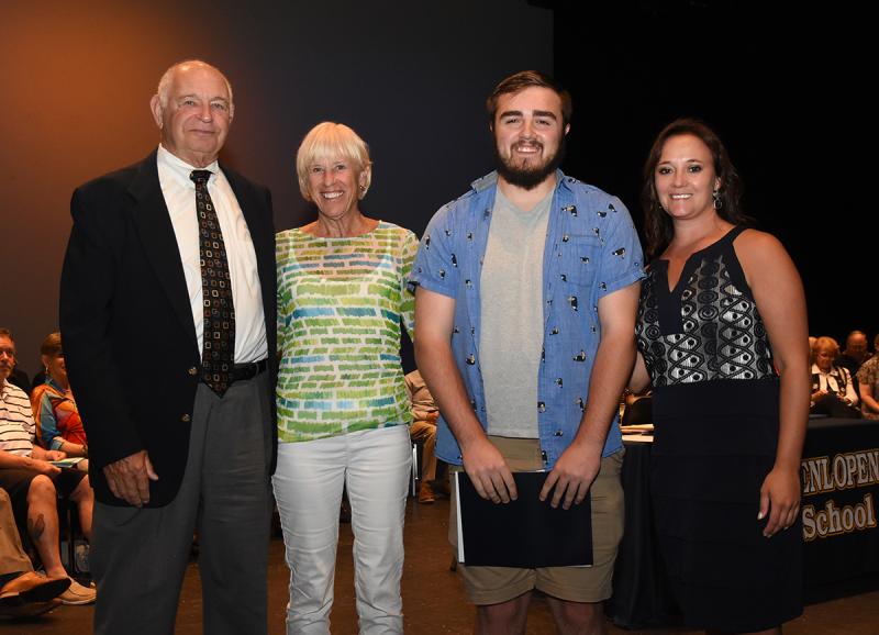 Blaise Hohl is shown with Dennis Crawford and Judy Hanson of Lewes in Bloom, and Cape Principal Nikki Miller.