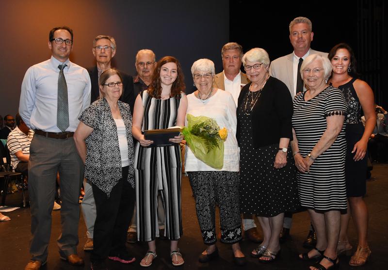Vienna Iacona, center, is shown with (l-r) Mike DiPaolo of Delaware Community Foundation, Estelle Stevenson and Connie Benko of the First Town Club of Lewes, Mary Beaman of the Delmarva Antique Bottle Club, William Battista and Tracy Mulveny of the Overfalls Foundation, Paul Carey of Lewes-Rehoboth Rotary, George Thomason and Michael Sprouse of Gallo Gives and Cape Principal Nikki Miller.