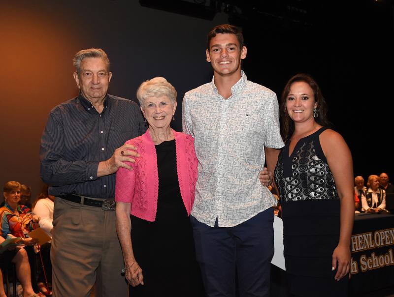Dylan Kaplan is shown with Skip and Fay Burnham of the Jeffrey Burnham Scholarship, and Cape Principal Nikki Miller.