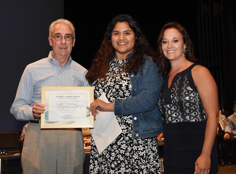Abigail Lopez, center, is shown with Rob Smith of the Andrea Chomo Smith Memorial Scholarship and Cape Principal Nikki Miller.