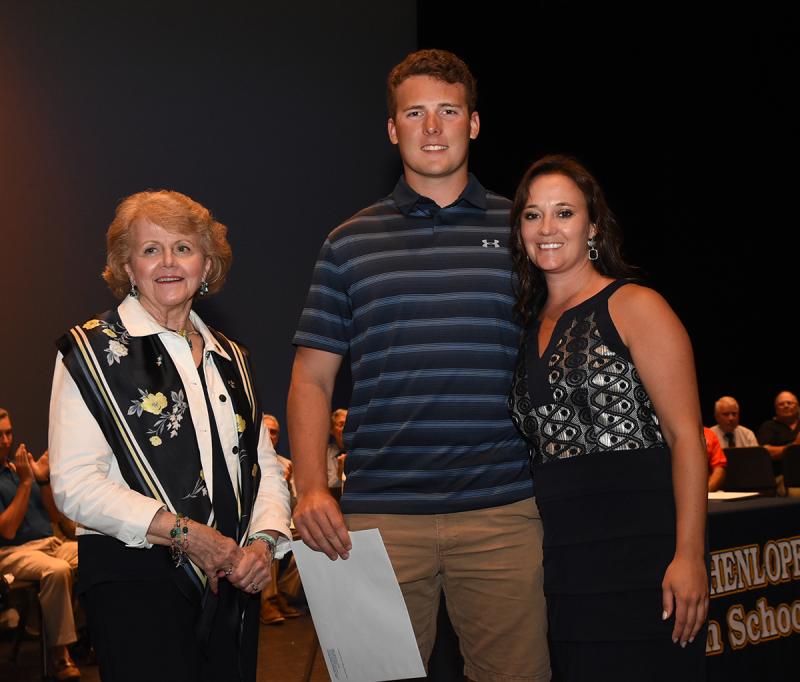 Austin Mendes, center, accepts his award with Carole Suchanek of Village Improvement Association and Cape Principal Nikki Miller, right.