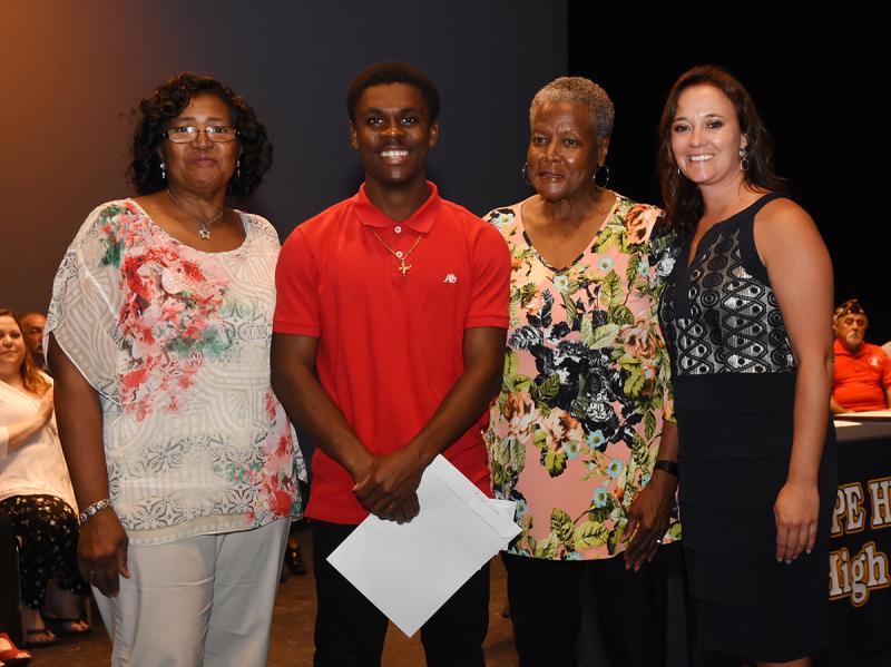 Curtis Purnell, second from left, is shown with (l-r) Janie Miller of the Dr. Martin Luther King Jr. Celebration Organization of Sussex County, Waynne Paskins of Sunshine Circle Club and Cape Principal Nikki Miller.