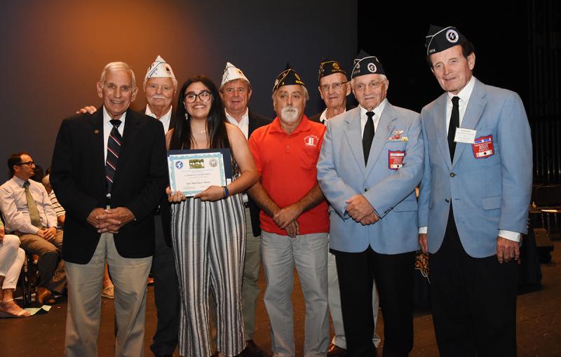 Almita Ramirez-Montano, third from left, is shown with (l-r) Col. Ronald Erale, Tom Jones and Dave Heffline of Sussex AmVets Post 2, Tom Dahl and Patrick Richardson of American Legion Post 5, and Walt Koopman and Jack McGinley of the Korean War Veterans Association Delaware Chapter 1.