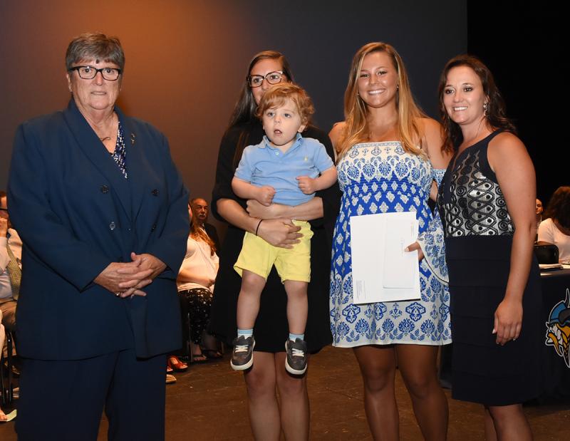 Marcella Sabbagh, center, is shown with (l-r) Debbie Windett, Kate Austin and Jackson Austin of the Bill Windett Memorial Scholarship, and Cape Principal Nikki Miller.