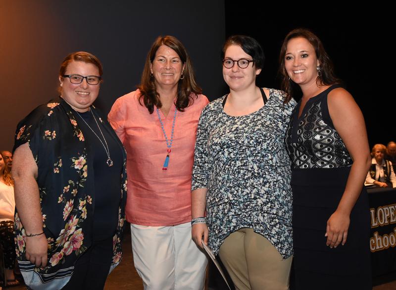 Sierra Touhey is shown with Patty Maull and Megan Tress of the Cape Henlopen Music Boosters, and Cape Principal Nikki Miller.