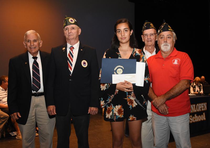 Yvette Rodriguez Villagomez, center, is shown with Col. Ronald Erale, Bob Shiles of Long Neck Sons of AmVets Post 22, and Tom Dahl and Patrick Richardson of American Legion Post 5.