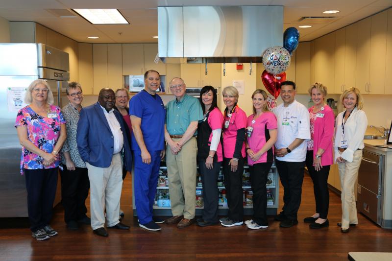 Beebe Believer and grateful patient Michael Strange gathers with some of his excellent care providers. Shown are (l-r) Debra Dobies, registered dietitian; Abby Tschoepe, Noninvasive Cardiovascular Services manager; Dr. Ray Kuretu, cardiothoracic surgeon; Nan Strange; Dr. Ramon Rosa, interventional cardiologist; Michael Strange; Lauren Rauch, administrative secretary; Juli Tugend, exercise physiologist; Tracy Tarr, RN; Miguel Cuevas, Ornish Program chef; Colleen Hruska, stress management specialist; and Mary Frances Suter, Beebe Healthcare Cardiovascular Service Line executive director. SUBMITTED PHOTO