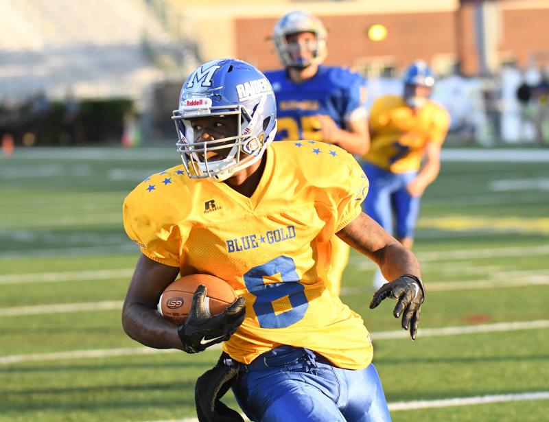 Ja’Mon Kane of Woodbridge runs for a first down.