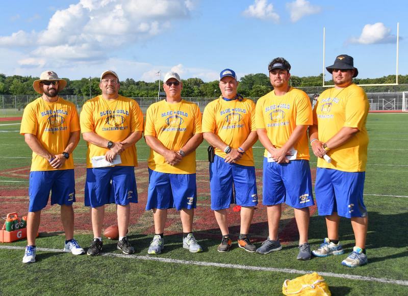 Coaching the Gold team are (l-r) Blair Newman, First State Military; Mike Tkach, Cape Henlopen; head coach Dan Candeloro, Caesar Rodney; Brian Berns, Caesar Rodney; Jed Bell, Woodbridge; and Shawn Strickland, Milford.