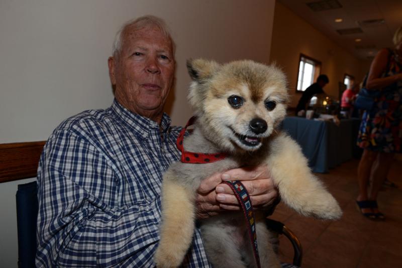 George McColley and Tilly take a seat on the sidelines at the event. DHA Wags. Whiskers and Wine