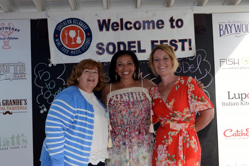 Gathered on the stage at Bluecoast Seafood Grill & Raw Bar Rehoboth are (l-r) Beau Biden Foundation for the Protection of Children Executive Director Patty Dailey Lewis, Creative Coastal Connections Executive Director Satcy LaMotta and Children & Families First Development Team Leader Laura Rimmer. So Del Fest 2019