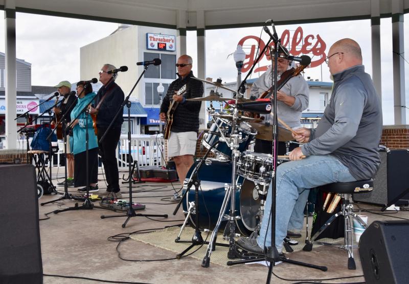 The band 33 1/3 performs on the Rehoboth Beach Bandstand during the send-off ceremony for the Torch Run.