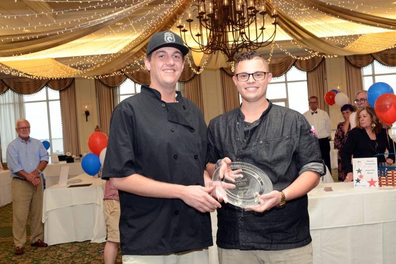 Off the Hook took home second place for seared tuna and red rice. Shown are Storm Miles, left, and Executive Chef Christian Constantino. Top Chef of The Culinary Coast