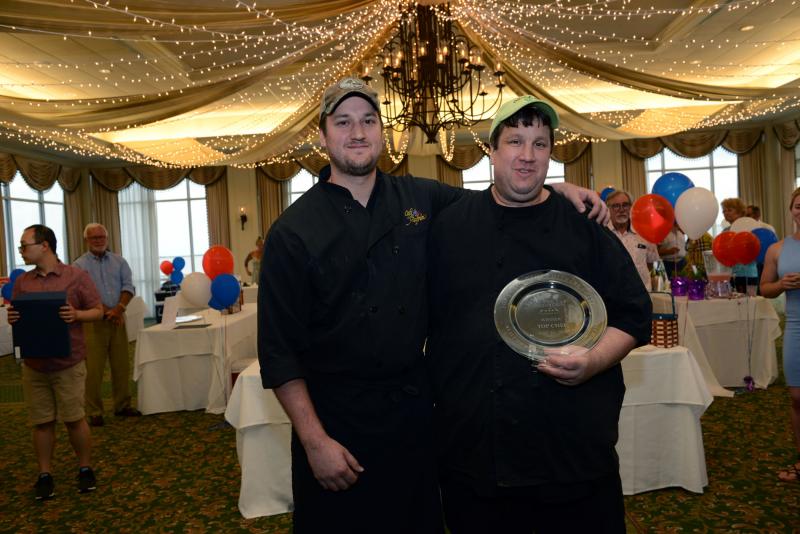 Taking home the 2019 Top Chef of the Culinary Coast for the second year in row was Café Azafran. Shown with the trophy are (l-r) chef Ryan Steele and chef/owner Richard Steele. Their top prize dish was seafood cake with Catalan guacamole, corn salsa, and spiced pita chips. Top Chef of The Culinary Coast