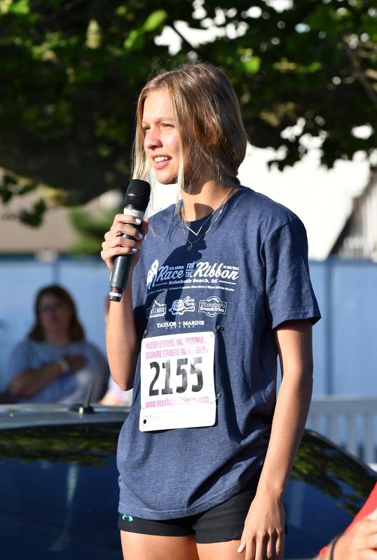 Logan Shuttleworth sings the national anthem.