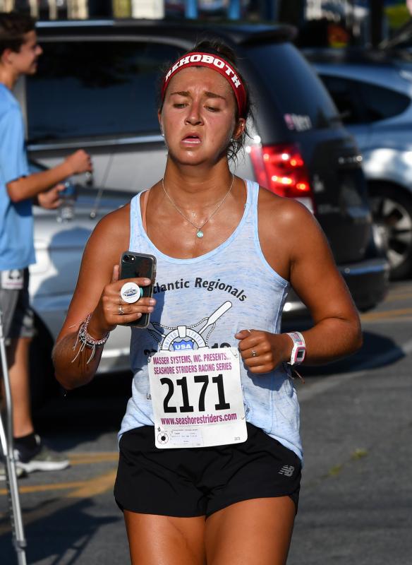 Lyndsay Taddei of the Rehoboth Beach Patrol finishes with a time of 23:02.