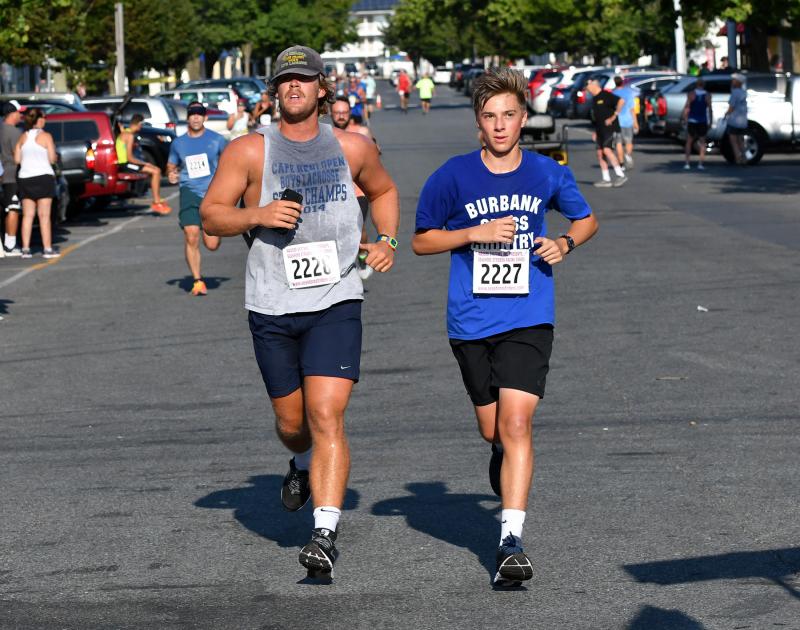 Grant Gillan of Lewes and Jake Bastian of Burbank, Calif., run to matching 24:54 times.