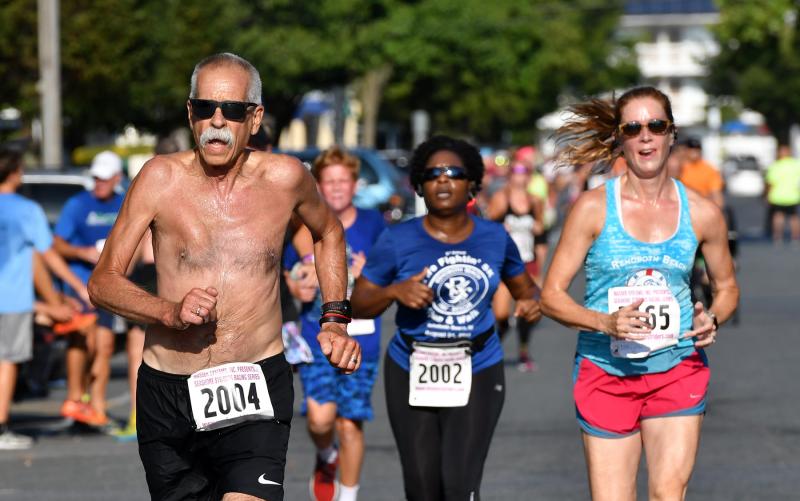 Ken Amey of Ambler, Pa., finishes first in the 65-69 age group with a time of 28:13.