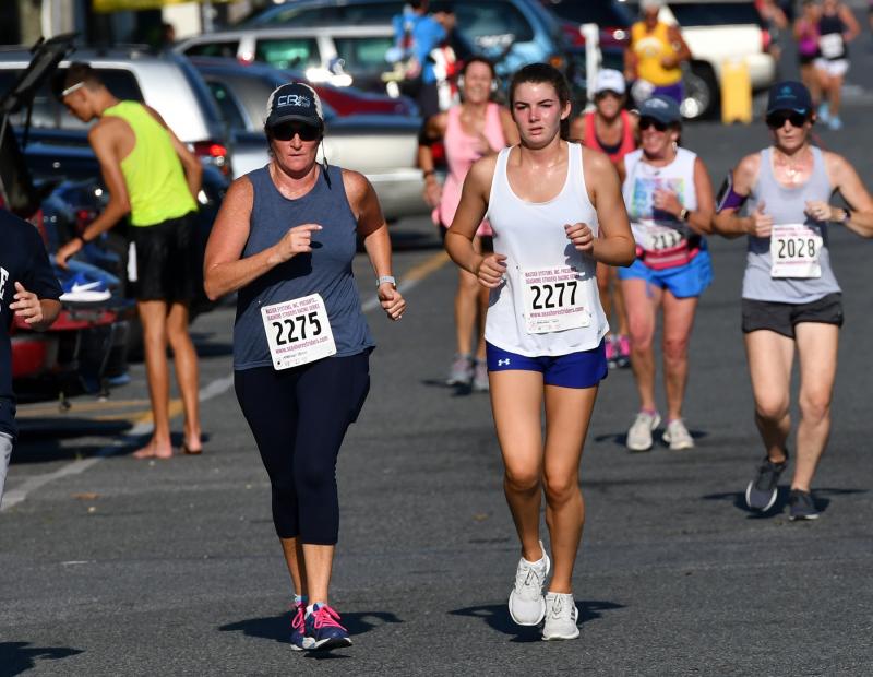 Ann, left, and Erin Morrissey finish in 32:42.
