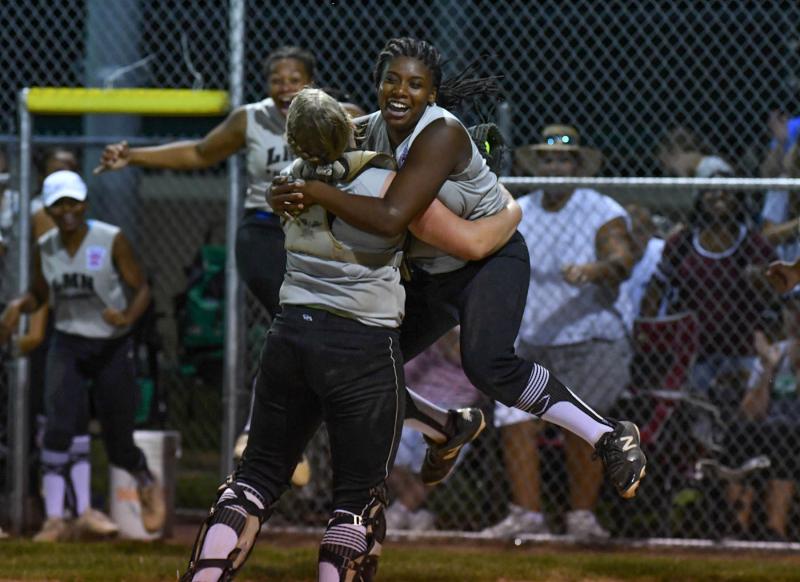 Laurel/Millsboro/Nanticoke pitcher Jada Evans, right, hugs catcher Kate Evick after defeating Georgetown/Cape/Lower Sussex 4-3 in the second game.