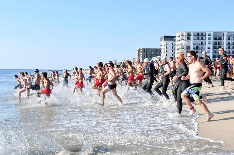 The first wave takes off for the half-mile swim.
