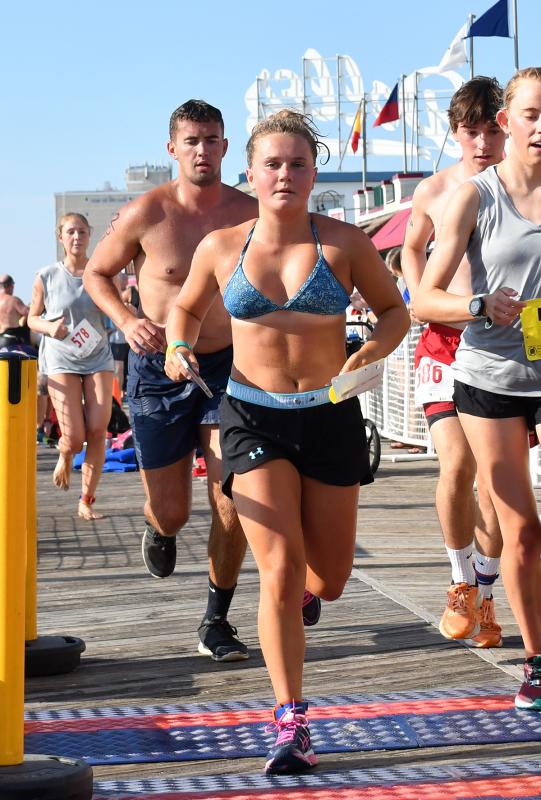 Melanie Fritchman leaves the transition area. She finished the event in 52:00.