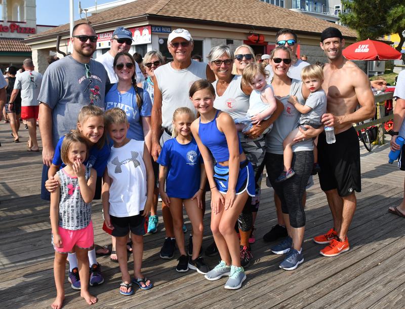 Dave Reynolds family members gather for an annual picture at the biathlon. Shown in back are (l-r) Mark Reynolds, Larry Mustico, Ashlee Reynolds, Donna Mustico, Jim Reynolds, Jo Ann Reynolds, Ashley Reynolds, Cora Reynolds, Jenny Matta, Doug Reynolds, Trent Matta and Dan Matta. In front are Piper Matta, Lily Reynolds, Cole Matta, Shayne Reynolds and Summer Reynolds.