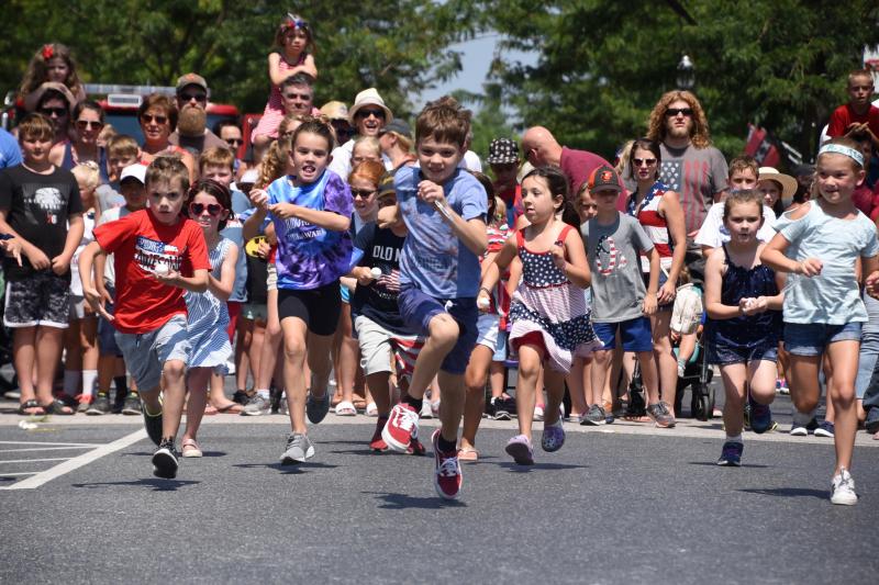 Racers try to not to drop their eggs as they race to the finish line.