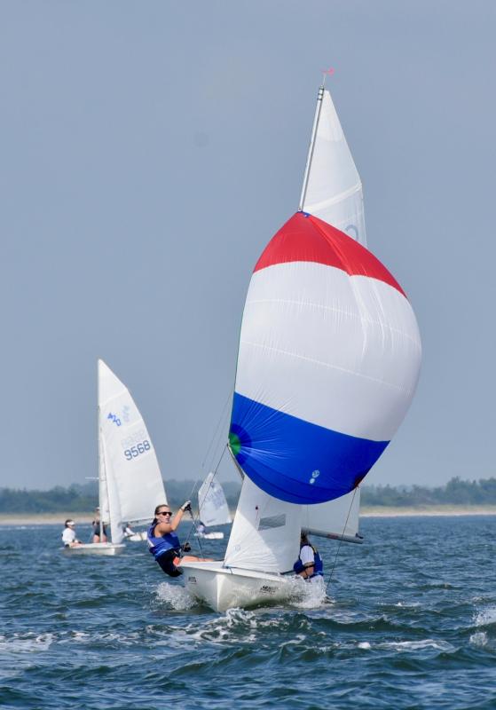 Olivia Sowa and Audrey Commerford of North East River Yacht Club in North East, Md., use their colorful spinnaker to gain speed.