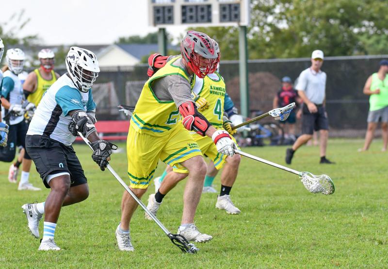Former Cape All-American and Lingo 30-plus middie Spencer Steele scoops a ground ball and goes to the Dogfish Head goal.