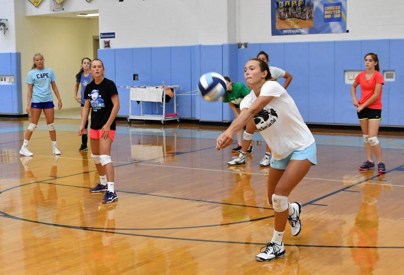 Katie Knarr bumps back a slam during a defensive drill.
