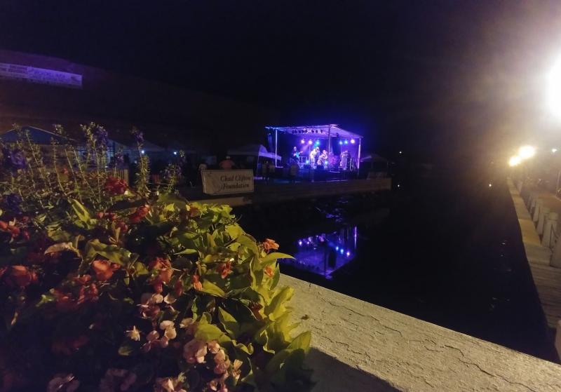 The Quayside stage kept rocking after dark for Concert for a Random Soldier. AQUARIANN PHOTO
