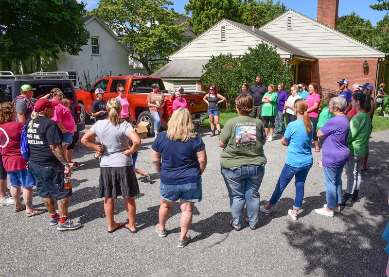 Grass Roots Rescue volunteers receive last-minute instruction from board member and founder Karli Crenshaw.