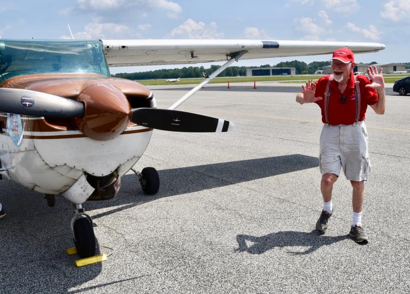 John Billings, who flew from Luray, Va., to Georgetown, reacts to a crowd waiting to wish him happy birthday.