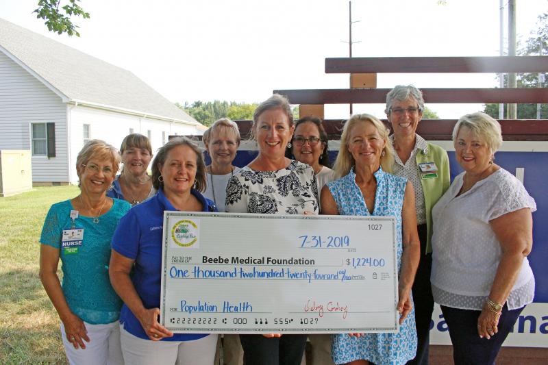 Check presentation attendees are (l-r) Mary Summerville, RN; Barbie Robets, administrative secretary; Catherine Murphy, MSN, RN; Stephanie Williams, RN, Kim Blanch, RN, community services manager; Kathi Fryling, food services; Valery Cordrey of East Coast Garden Center; Diane Barlow, Beebe Medical Foundation gift officer; and Ronni Smith, RN. SUBMITTED PHOTO