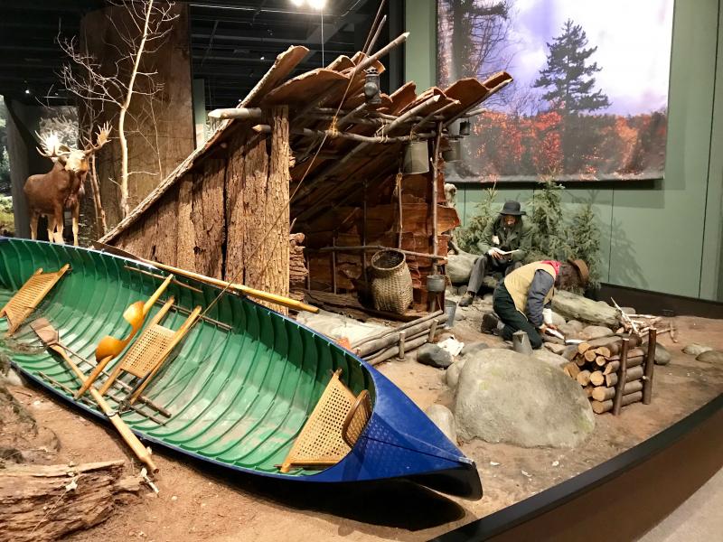 This display shows a 19th century Adirondack fishing camp, one man cleaning trout for the evening’s dinner, the other man sitting on a log reading a book, maybe one of Washington Irving’s histories of the Hudson River Valley. That would be me.