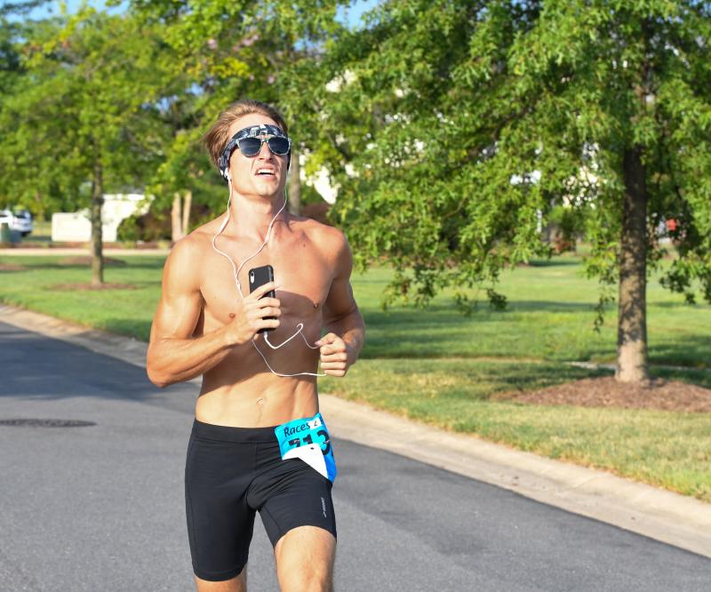 Mike Marciano, a former wrestler and a surfer, leads the Greene Turtle 5K at the mile mark. Mike placed third in the race.