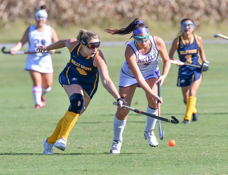 Royals freshman Myra Browning, right, moves the ball past Holly Grove’s Dusty-Rose Miller. DAN COOK PHOTOS