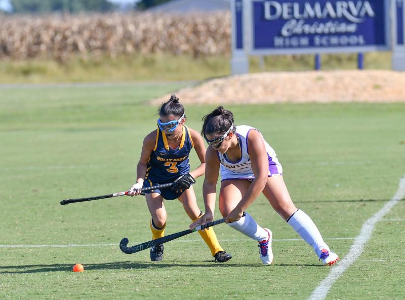 Delmarva Christian’s Annika McCullough, right, controls the ball from Holly Grove’s Bethany Hartman.