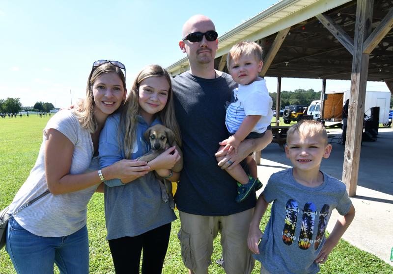 The Linton family adopted Myrtle, one of Carolina’s puppies. Shown are Denise, Alania, Haney, Ryker, and Bentley.