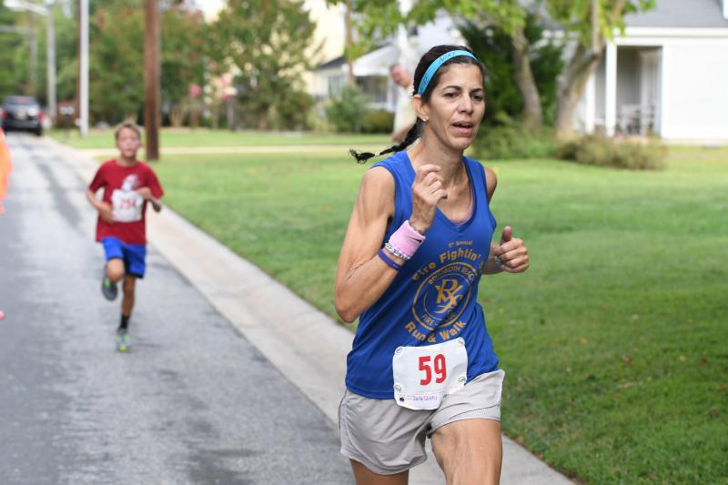 Jackie Quigley wins the women’s masters race in 23:15.