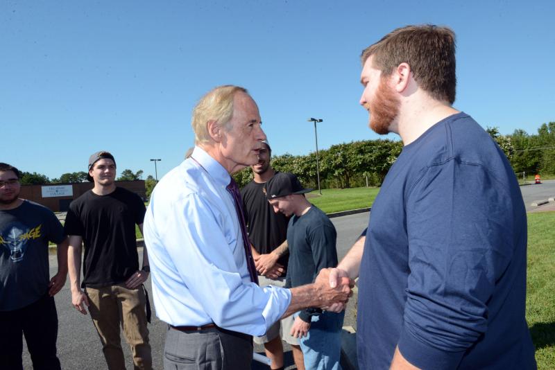 U.S. Sen. Tom Carper spoke with Automotive Center of Excellence students at the groundbreaking. Carper is shown shaking hands with first-year student Morgan DeWitt. DelTech Automotive