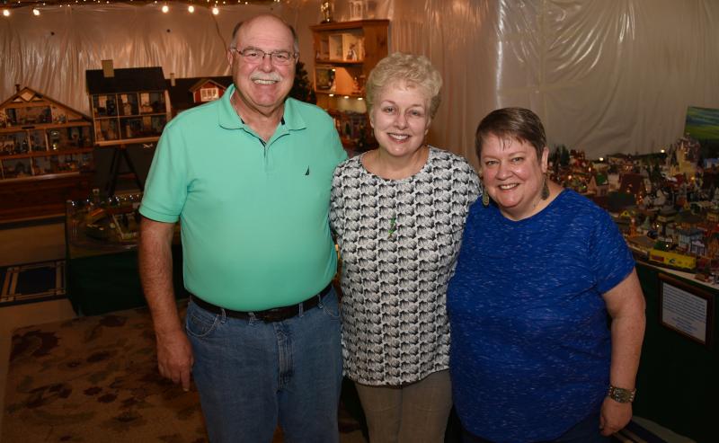 Walt and Cathy Tydings, left, and Liz McCubbin spend a lot of time in the Tydings’ basement working in the world of miniatures.