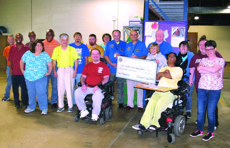 The Knights of Columbus, St. Joseph Council 3792 conducted an annual Tootsie Roll drive, collecting $1,934.25 in donations to support individuals with intellectual or physical disabilities at KSI. Shown at the presentation, Knights Fritz Schmulling, Dominic Romano, and Tom Farrell (center of picture with ceremonial check) are surrounded by KSI program participants giving thanks for their support: (l-r) Matthew Biscoe, James Hood, Michael Bolden, Michelle Gomes, Leroy Hicks, Stevie Miller, Jesse Hunt, Colby Motes, Josh Chaffinch (sitting), Laura Davis, Mr. Schmulling, Mr. Romano, Mr. Farrell, Sally Skweres, Paula Green (sitting), Catherine Schaeffer, Samantha Henry, and Mary Beth Auten. SUBMITTED PHOTO