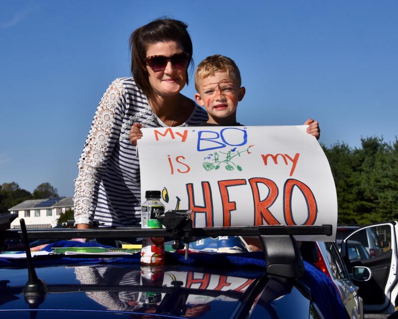 Kathryn and Bennett Marriott of Elkton, Md., wait for their husband and father, Bo, to reach a rest stop on the route. He was riding for his uncle, William Clark, as part of the Northrup Grumman team.