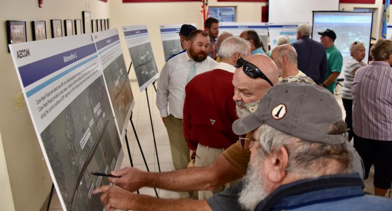 Area residents look at the five proposed alternatives for the Cave Neck Road-Route 1 intersection north of Lewes. RON MACARTHUR PHOTOS