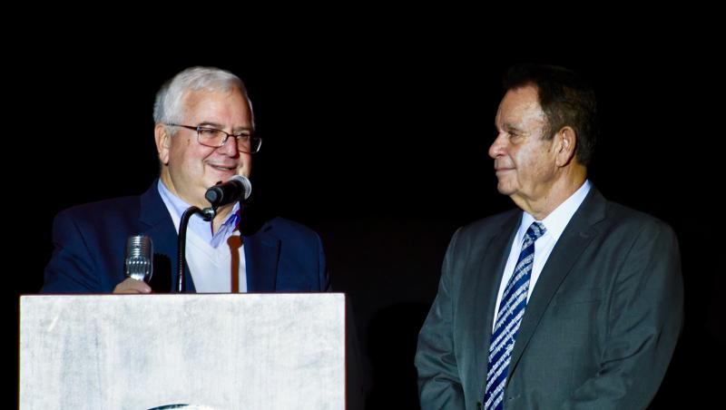 John Ernesto, left, accepts the Producer of the Year Award from Denny Santangini, president of the Rehoboth Beach Jazz Festival, during jazz festival opening night at Cape Henlopen High School. Ernesto is general manager of Berks Jazz Festival in Reading, Pa. RON MACARTHUR PHOTO