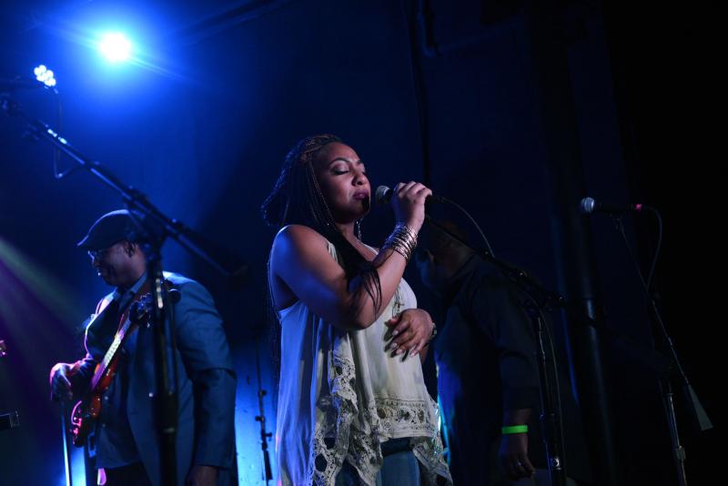 Selina Albright sings a solo during the Closing Party Sunday night at the Rusty Rudder. STEVEN BILLUPS PHOTO